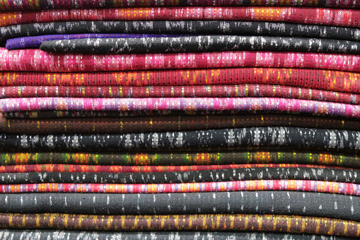 Handicraft traditional weaving fabric clothing costumes of Thailand in colourful patterns