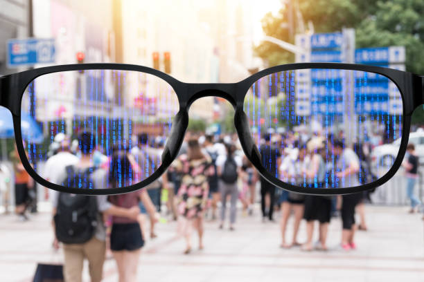 istock Augmented reality , smart AR glasses technology , smart city , internet of things concept. Customer using AR application see digital binary coded data with blur city people background. 831590082