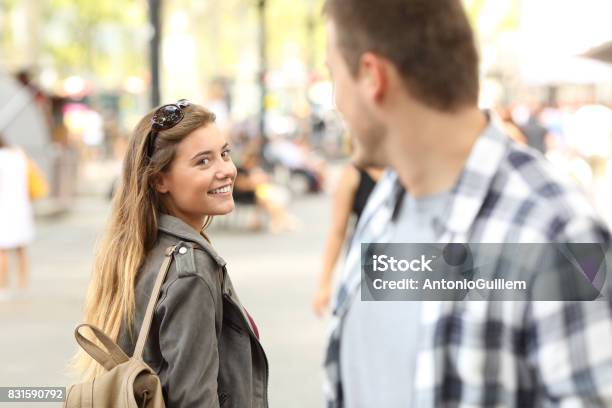 Strangers Girl And Guy Flirting On The Street Stock Photo - Download Image Now - Love At First Sight, Flirting, Women