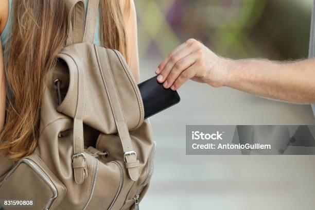 Thief Stealing A Phone From A Bag Stock Photo - Download Image Now - Stealing - Crime, Mobile Phone, Thief