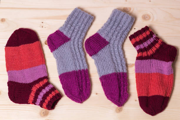 istock knitted socks on wooden background 831591308