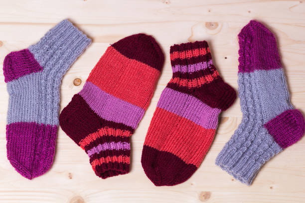 istock knitted socks on wooden background 831591352