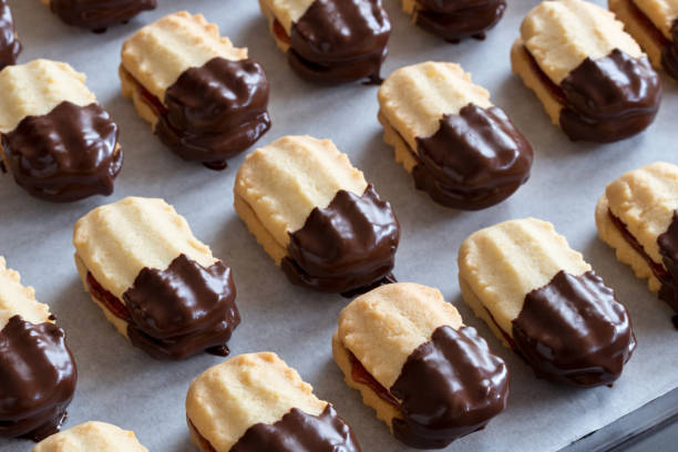 istock Christmas cookies filled with jam and dipped in chocolate 831593774