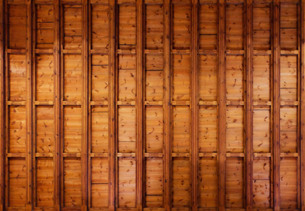 A wooden surface with a grid pattern. Such woodwork is used mostly for ceilings and walls inside of buildings.