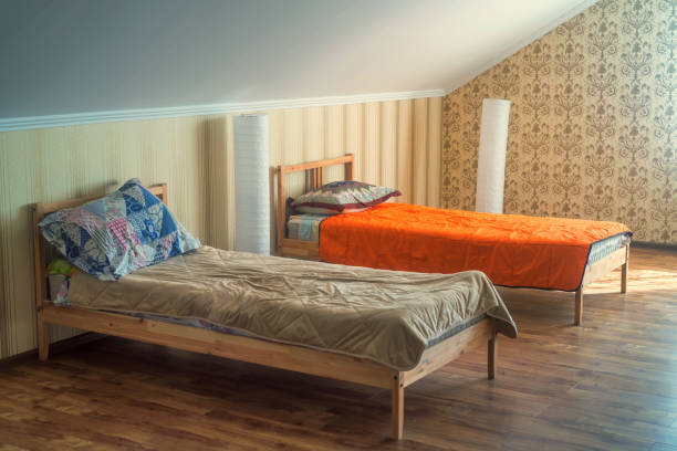 istock Interior of small hostel room with two beds 831600814