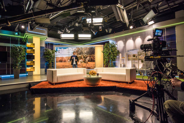 Celebrity talk show Talk show host standing in television studio. television studio stock pictures, royalty-free photos & images