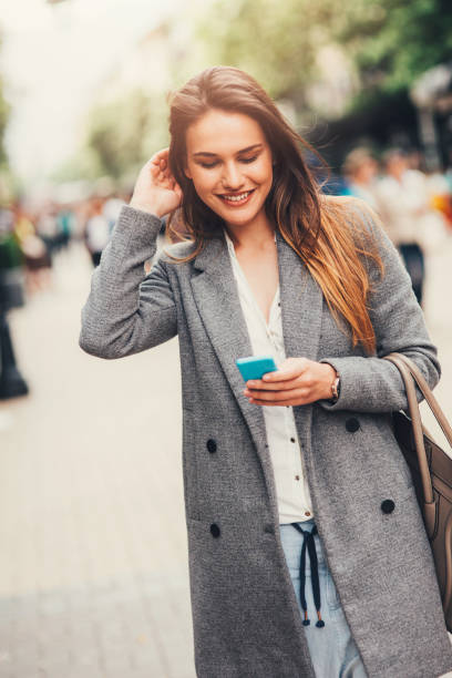 istock Woman texting in the city 831604140