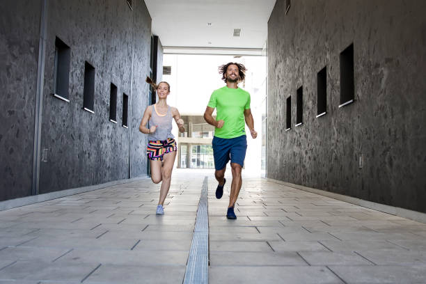 istock Couple practicing jogging in the city 831618994