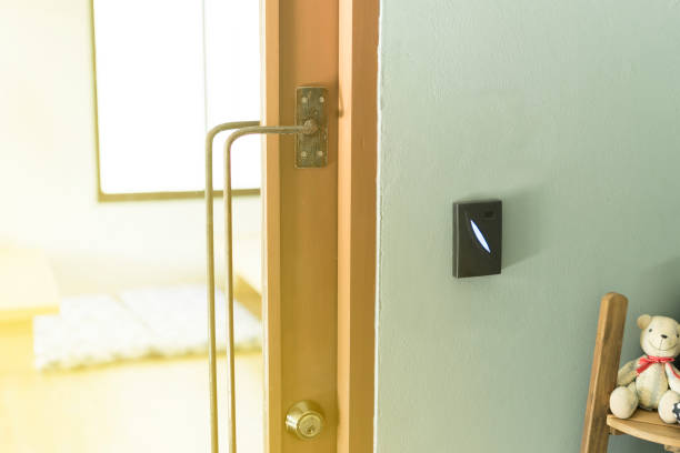 istock vintage Door Handles on wood mirror with locking modern style with access control for scanning key card to pass to room 831619590