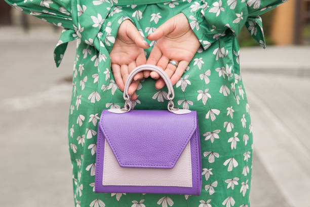 istock Woman with purple handbag 831621838
