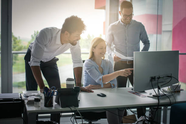 istock Business people using technology and having conversation. Business people at the office. 831622204