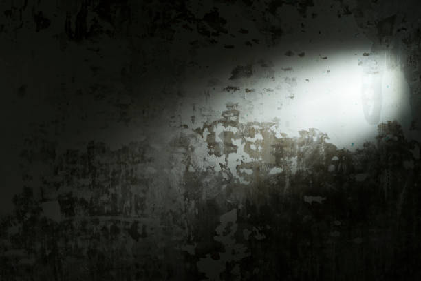 istock Spot light in a dark scary vintage background wallpaper 831622218