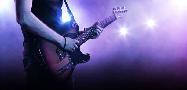 istock Guitarist playing a guitar, close-up 831622260