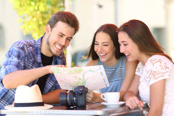 istock Tourists planning trip in a bar 831622958