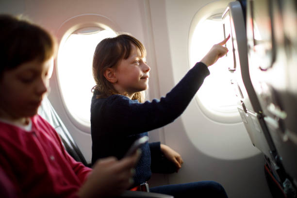 istock Tourist girl using smart phone while traveling with her sister 831622994