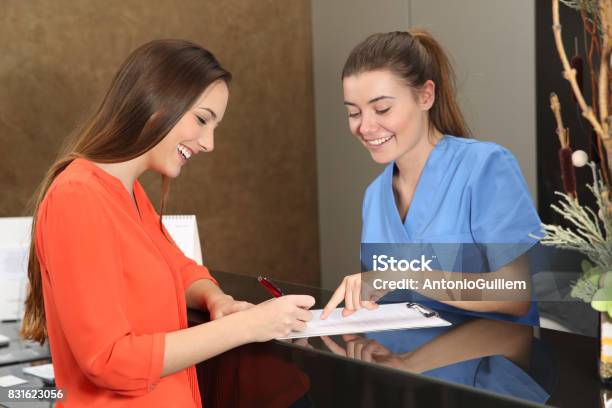 Patient Being Attended In A Medical Consultation Stock Photo - Download Image Now - Receptionist, Healthcare And Medicine, Medical Exam