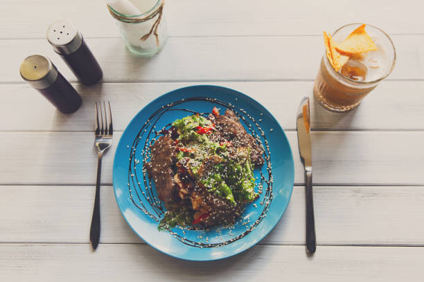 istock Restaurant food, warm meat salad top view 831626220