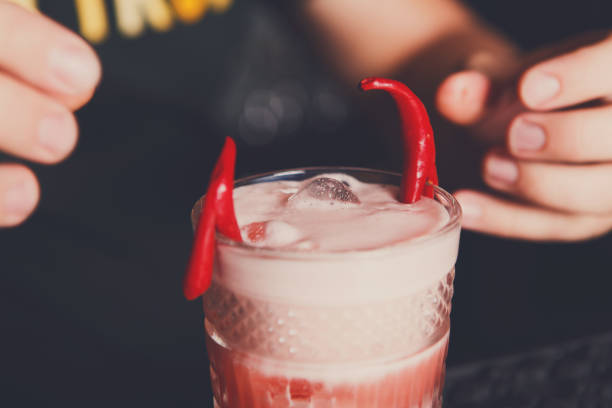 istock Creative spicy cocktail at bar background 831626938