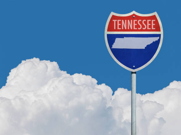 istock Highway sign for Interstate road in Tennessee with map in front of clouds 831629598