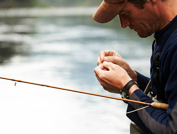 vinculando atrai pescadores com mosca - fishing bait - fotografias e filmes do acervo