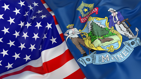 Close-up of USA flag with flag of Maine