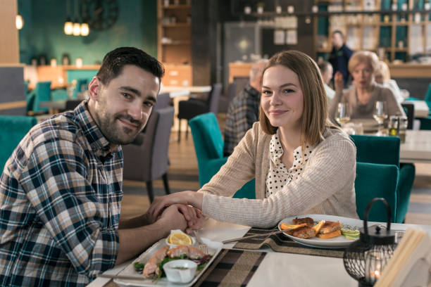 istock Couple having romantic dinner in restaurant 831635078