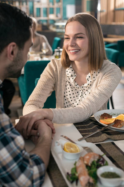 istock Couple having romantic dinner in restaurant 831635080