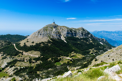 Mount Lovcen. Lovcen is a mountain and national park in southwestern Montenegrothat rises from the adriatic and stretches over to Kotor.