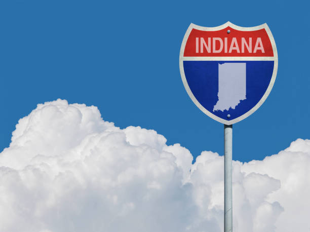 istock Highway sign for Interstate road in Indiana with map in front of clouds 831638256