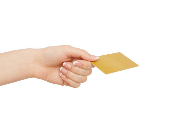 istock Woman's hand holding plastic card, crop, cut out 831639488