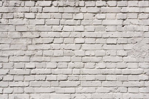 istock full frame of white grunge textured brick wall background 831639684