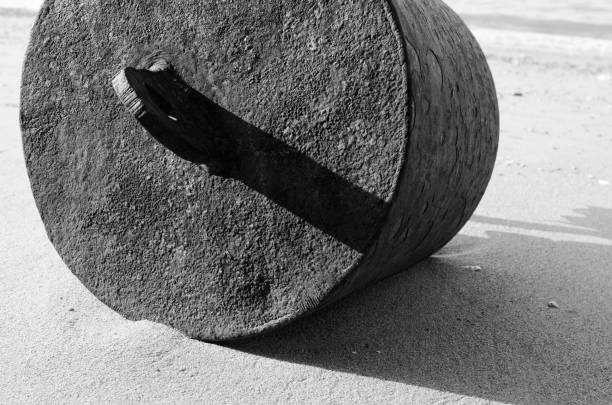 istock Monochrome: Close up Old buoy on beach with hard light 831639714