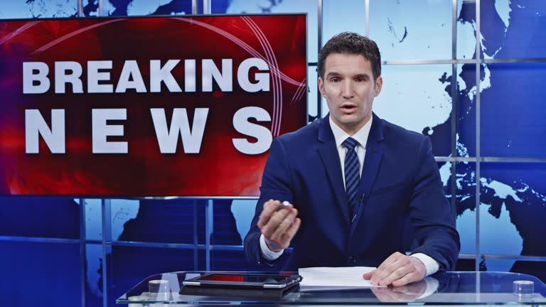 LD Caucasian male anchor presenting breaking news