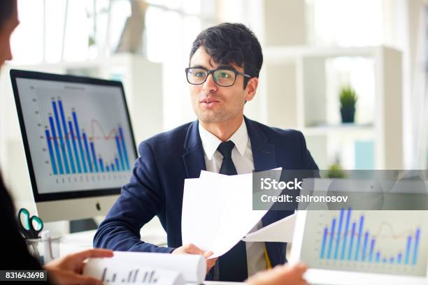 Consulting With Colleague Stock Photo - Download Image Now - Economist, Adult, Adults Only