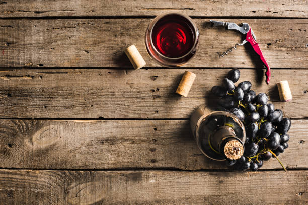 bottle of wine, wineglass and grapes - wineglass red wine wine liquid imagens e fotografias de stock
