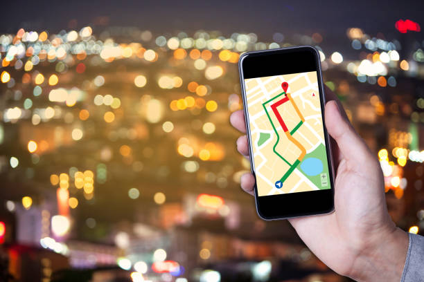 istock Hand of man using map on smartphone application with bokeh background of city. 831644110