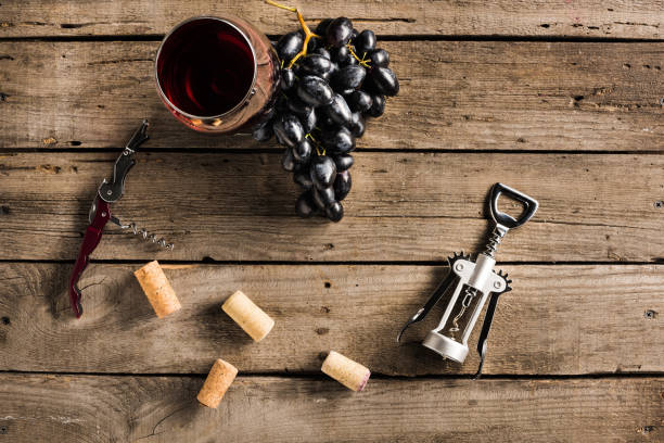 istock glass of red wine and grapes 831644902