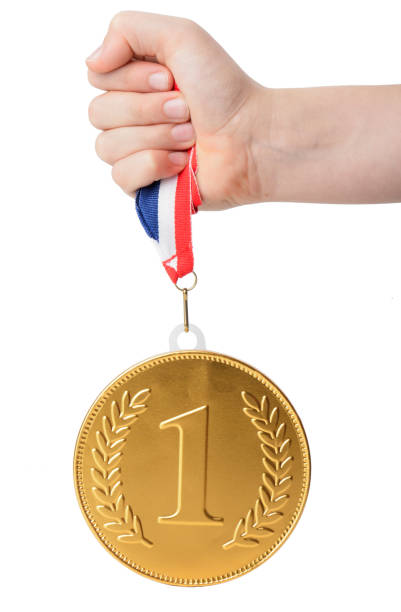 istock A large gold number one medal held up 831647434