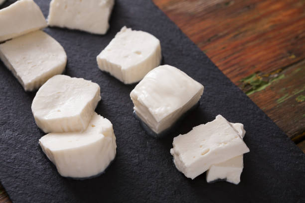 istock Homemade mozzarella on black stone background 831648992