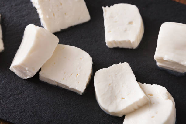 istock Homemade mozzarella on black stone background 831651052