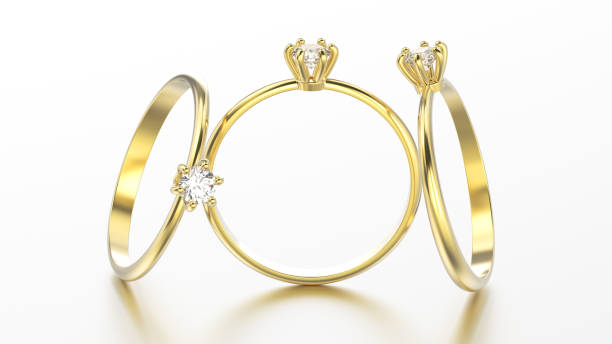 istock 3D illustration three yellow gold traditional solitaire engagement diamond rings with reflection 831651804