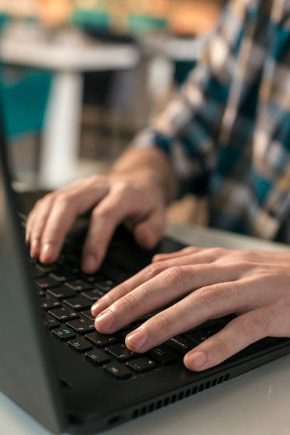 istock Man working on laptop in restaurant 831652106
