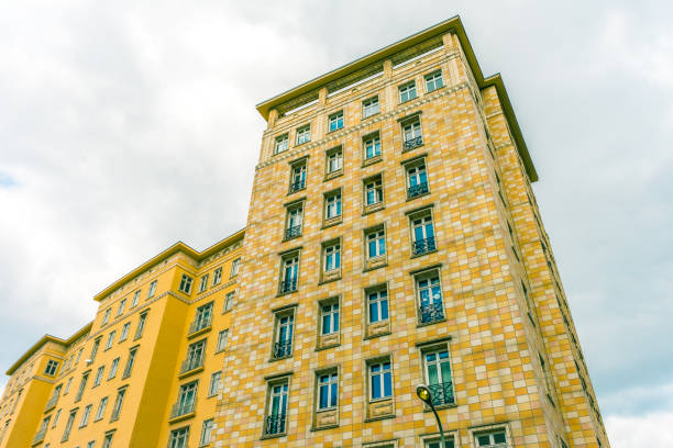 istock high apartment building with yellow facade 831652278