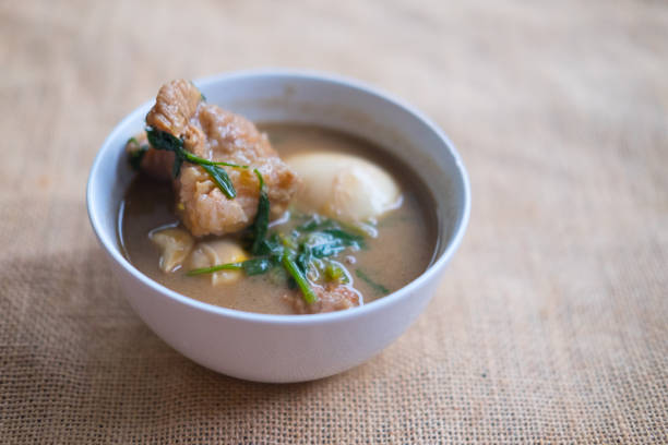 istock Eggs stewed pork with tofu in white bowl 831656540