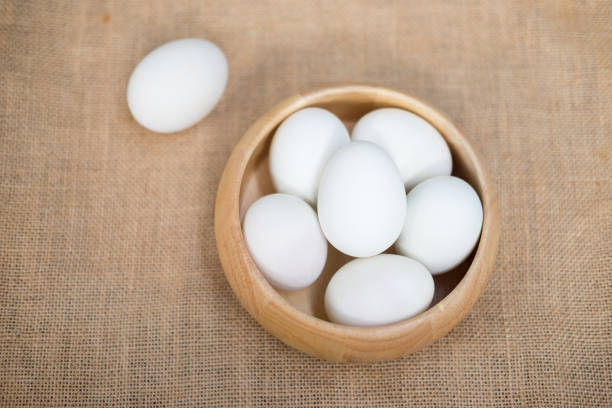 istock Salted duck egg in a wooden bowl on sackcloth 831656904
