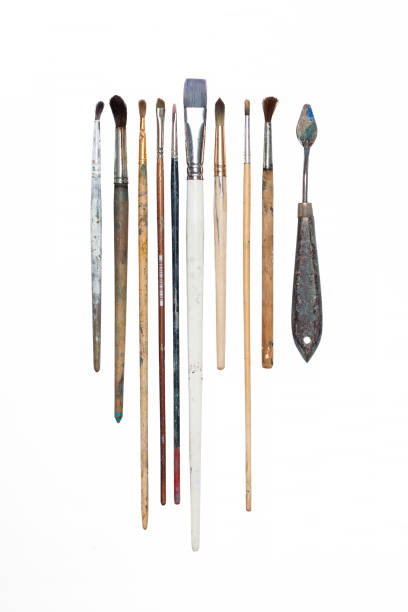 istock Old oil paint brushes isolated 831656932