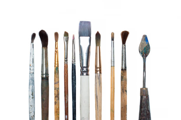 istock Old oil paint brushes isolated 831657028