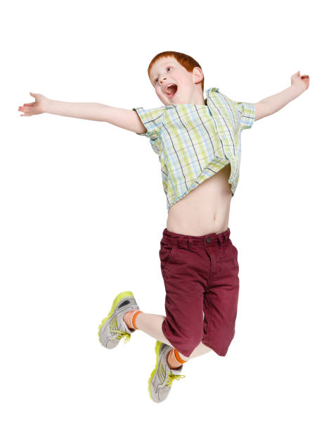 istock Happy laughing boy jumping on white isolated background 831659394