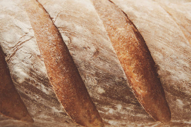 istock Bread texture background, closeup of baguette loaf 831659926