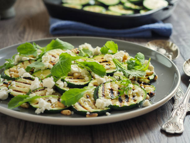 istock grilled courgette with pine nuts and feta cheese salad 831662122